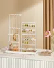 A white jewelry organizer stand filled with various necklaces, earrings, a watch, and a perfume bottle, placed on a marble-like surface. Produktbild-Vorschau