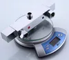 A chrome shower valve is placed on a digital scale. Náhled obrázku produktu