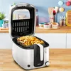 A deep fryer filled with french fries is shown on a kitchen counter. Produktbild-Vorschau