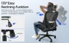 A person is sitting in a black office chair, demonstrating its reclining function. Produktbild-Vorschau