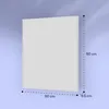 A white rectangular panel, likely an infrared heater, is shown mounted on a light blue wall. Dimensions are indicated with dashed lines and text. Náhľad obrázku produktu
