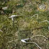Two white soil moisture sensors with cables lying on grass. Produktbild-Vorschau