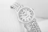 A close-up, studio shot of a silver Casio watch with a white face, placed on a textured white surface. Anteprima dell’immagine prodotto