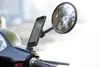A smartphone mounted on a scooter's mirror, displaying navigation. Anteprima dell’immagine prodotto