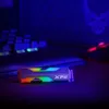 A close-up shot of an SSD with RGB lighting, placed on a dark surface with a keyboard and a mouse in the background, all under blue lighting. Podgląd zdjęcia produktu