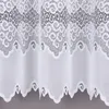 A close-up view of a white lace curtain. Náhľad obrázku produktu