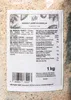 A close-up of a food product label on a textured surface. Produktbild-Vorschau