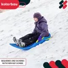 A child is sledding down a snowy hill. Voir les images du produit