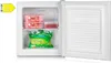 An open freezer compartment with food inside. Voir les images du produit