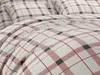 A close-up view of bedding with a plaid pattern. Náhľad obrázku produktu