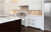A modern kitchen with white cabinets and drawers, featuring antique bronze cabinet handles. Produktbild-Vorschau