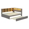 A modern upholstered daybed with a built-in bookcase headboard and a pull-out trundle bed, shown against a white background. Náhled obrázku produktu
