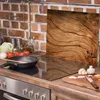 A kitchen counter with cooking ingredients and a stovetop. Produktbild-Vorschau