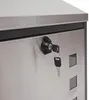 A close-up view of a lock and key on a metal mailbox. Produktbild-Vorschau