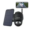 A black Reolink security camera with a solar panel and a smartphone displaying a live feed. Produktbild-Vorschau
