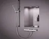 A modern bathroom shower fixture with a built-in shelf. Produktbild-Vorschau