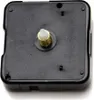 A close-up view of the back of a black quartz clock movement mechanism. Produktbild-Vorschau
