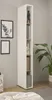 A tall, narrow white storage unit with shelves is placed against a light gray wall, next to framed artwork and a large potted plant. The unit contains books and decorative items. Produktbild-Vorschau