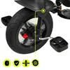 A close-up view of a child's tricycle wheel and pedal, with icons indicating product features at the bottom. Produktbild-Vorschau
