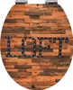 A toilet seat with a wood-like texture and the word "LOFT" spelled out in marquee-style letters with lights. Produktbild-Vorschau