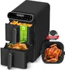 A black dual-chamber air fryer with food inside, along with a bonus silicone liner and a cooked chicken. Náhľad obrázku produktu