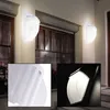 A collage of images showing outdoor wall lights, including close-ups of the product's design and a detail shot of its illumination. Náhľad obrázku produktu