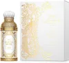 A perfume bottle and its box, both decorated with intricate gold patterns on a white background. Voir les images du produit