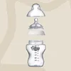 An exploded view of a baby bottle and its components against a neutral background. Produktbild-Vorschau