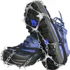 A pair of blue hiking boots with metal spikes and chains attached to the soles for traction on ice or snow. Náhled obrázku produktu