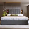 A modern bedroom with a large upholstered bed. Produktbild-Vorschau