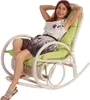 A woman is sitting in a rocking chair. Náhled obrázku produktu