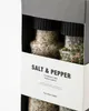 A close-up view of a gift box containing two spice grinders, with a label indicating 'Salt & Pepper'. Produktbild-Vorschau