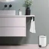 A modern bathroom setting with a vanity, sink, and a trash can. Anteprima dell’immagine prodotto