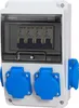 A white electrical distribution box with a transparent cover, showing four circuit breakers inside and two blue electrical outlets on the front. Produktbild-Vorschau
