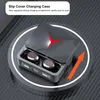 A pair of black wireless earbuds in a charging case, placed on a circular charging pad. Náhľad obrázku produktu