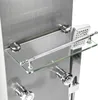 A close-up view of a modern stainless steel shower panel with a glass shelf and chrome fixtures. Podgląd zdjęcia produktu