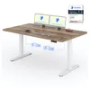 A standing desk with dual monitors, keyboard, and mouse. Anteprima dell’immagine prodotto