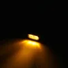 A close-up shot of a black and tinted LED light with a yellow glow emanating from it, set against a black background. Podgląd zdjęcia produktu