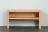 A wooden bench with two shelves against a white wall. Produktbild-Vorschau