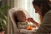 A mother feeding her baby in a high chair. Voir les images du produit