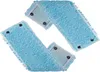 Two blue mop heads with white trim and snap fasteners are arranged diagonally on a white background. Produktbild-Vorschau