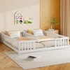 A bedroom scene with two white wooden children's beds side-by-side, decorated with pillows and a small book on the rug. Anteprima dell’immagine prodotto