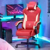 A gaming chair and computer setup in a room with ambient lighting. Náhled obrázku produktu