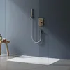 A modern bathroom shower area with a white shower tray, a wall-mounted shower head and controls, and a wooden stool with a soap dispenser and bar of soap. Anteprima dell’immagine prodotto