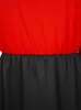 A close-up view of the top part of a red and black dress. Anteprima dell’immagine prodotto