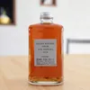 A bottle of Nikka From the Barrel whisky sits on a wooden table. Produktbild-Vorschau