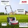 A lawn scarifier/aerator is shown on a grassy lawn with a house in the background. Náhľad obrázku produktu