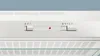 A close-up view of the control panel of a white range hood. Voir les images du produit