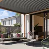 A modern patio with a pergola, outdoor sofa, and coffee table. Náhled obrázku produktu