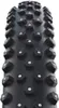 A close-up, studio shot of a bicycle tire with prominent studs. Podgląd zdjęcia produktu
